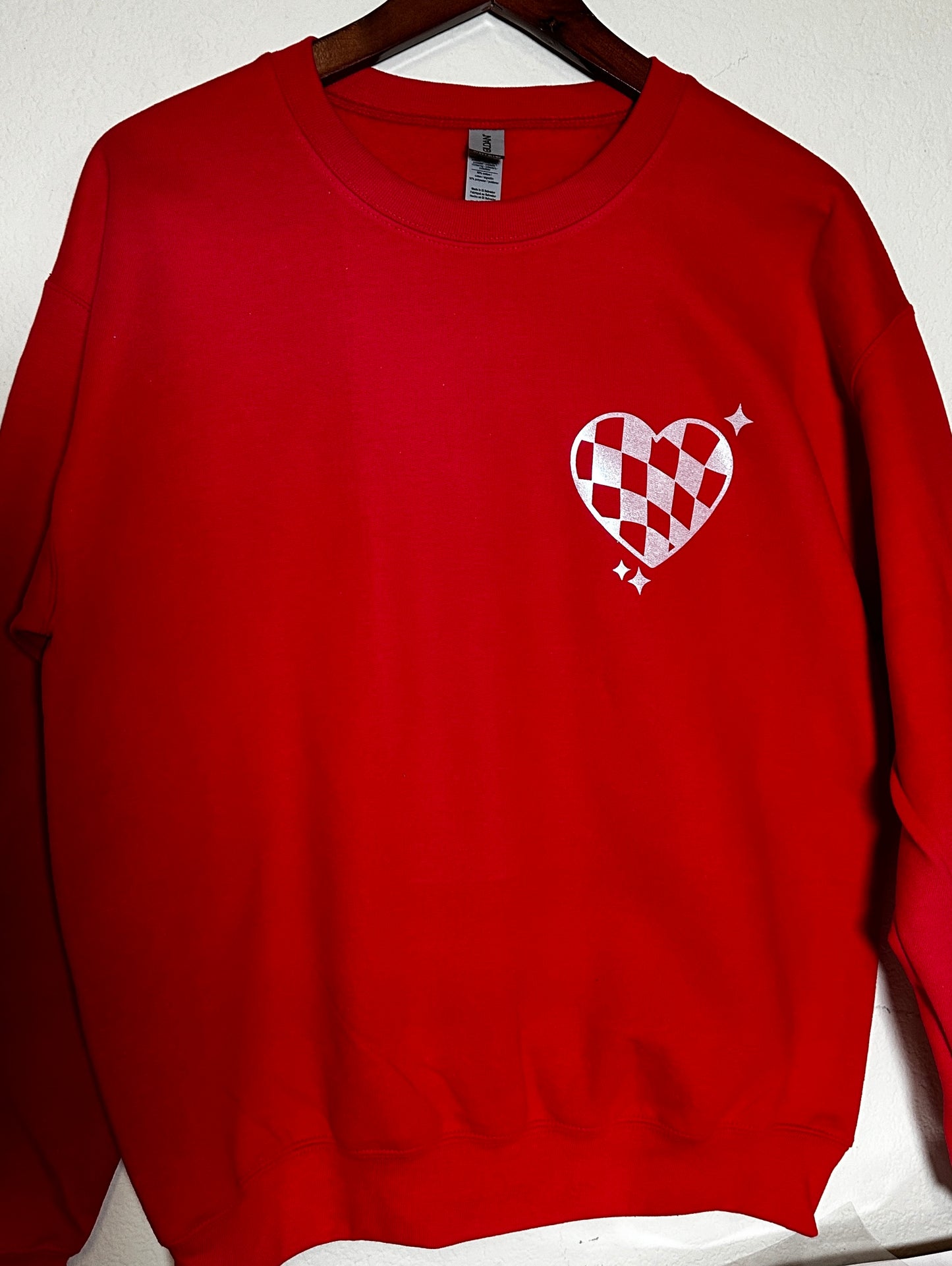 We Love Because He First Loved Us” Red Christian Sweatshirt