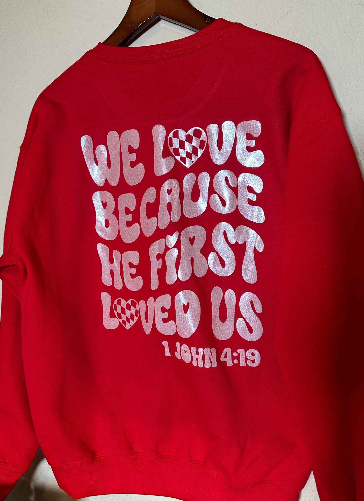 We Love Because He First Loved Us” Red Christian Sweatshirt